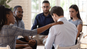 young man participating in group therapy as part of finding dual diagnosis treatment in north carolina