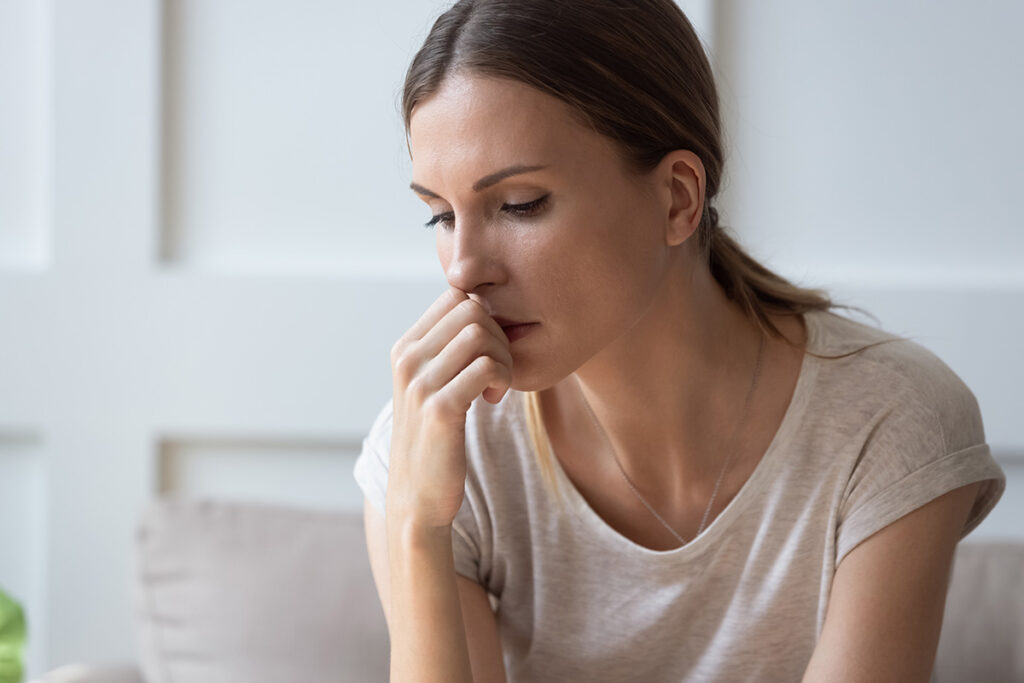 A woman thinking about substance abuse in women