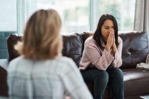 Woman pensive at therapy session
